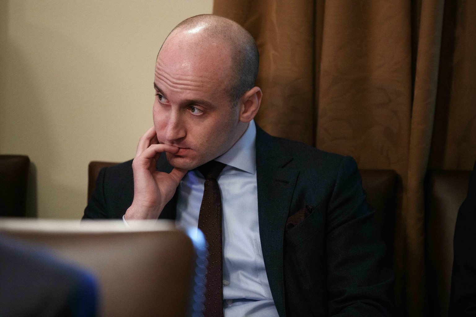 FILE- In this Jan. 2, 2019, file photo White House senior adviser Stephen Miller listens as President Donald Trump speaks during a cabinet meeting at the White House in Washington. Miller indicated Su ...