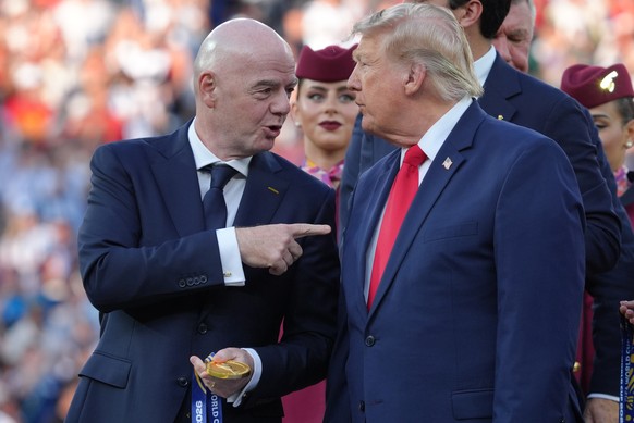 FIFA President Gianni Infantino, left, and President Donald J. Trump talk as they wait to congratulate the Spanish players after the World Cup final soccer match between Spain and Argentina in East Ru ...