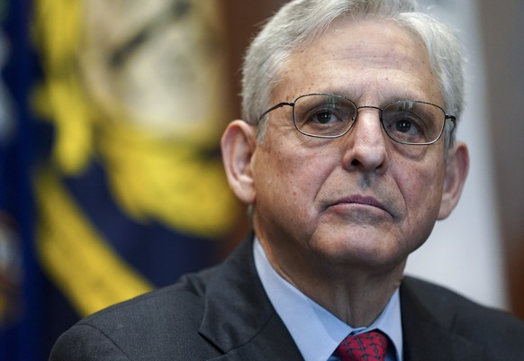 FILE - Attorney General Merrick Garland listens during a meeting of the COVID-19 Fraud Enforcement Task Force at the Justice Department, March 10, 2022 in Washington. Treasury Secretary Janet Yellen a ...