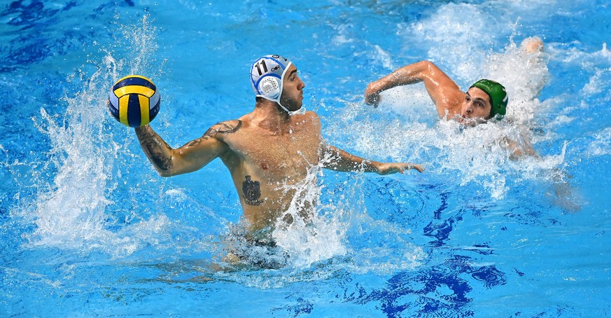 epaselect epa09054450 Edoardo Di Somma (L) of Brescia prepares to throw the ball past Giannis Fountoulis of FTC-Telekom Waterpolo during men���s water polo Champions League group stage match Brescia v ...