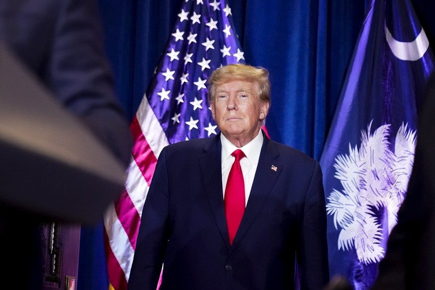 FILE - Former President Donald Trump listens as he is introduced to speak at the South Carolina Statehouse, Jan. 28, 2023, in Columbia, S.C. Trump can be sued by injured Capitol Police officers and De ...