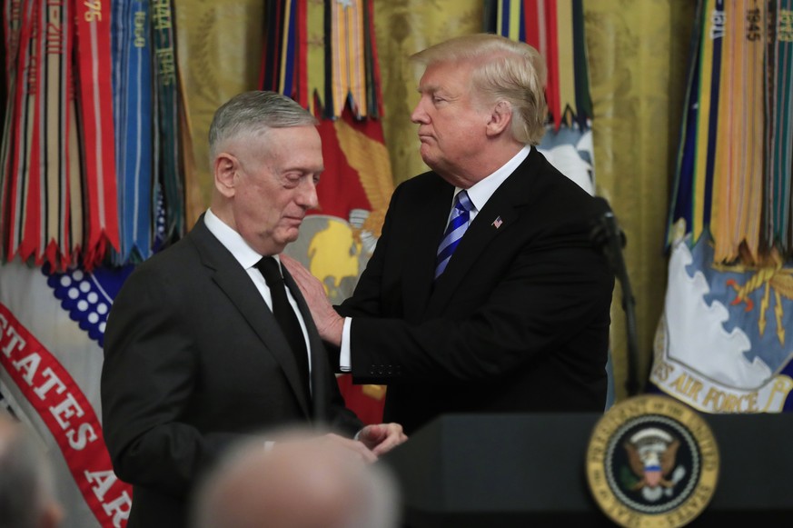 President Donald Trump acknowledges Defense Secretary Jim Mattis during a reception commemorating the 35th anniversary of the attack on Beirut Barracks in the East Room at the White House in Washingto ...