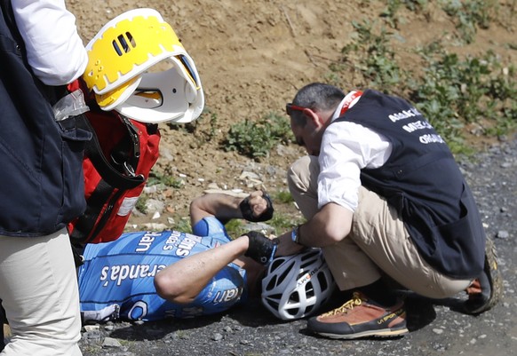 epa06655080 Veranda&#039;s Willems team rider Michael Goolaerts of Belgium is attended to by medics after allegedly suffering a cardiac arrest following a crash during the 116th Paris Roubaix cycling  ...