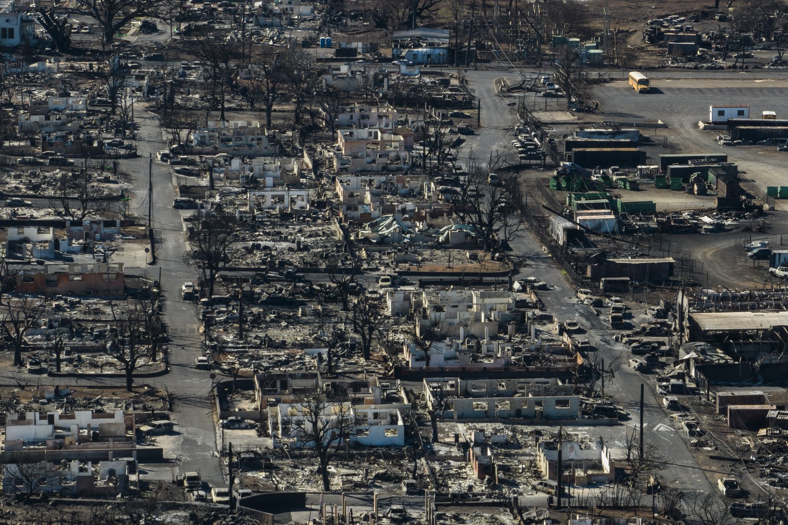 FILE - A general view shows the aftermath of a wildfire in Lahaina, Hawaii, Thursday, Aug. 17, 2023. Hope is hard to let go of as odds wane over reuniting with still-missing loved ones after a fire sw ...
