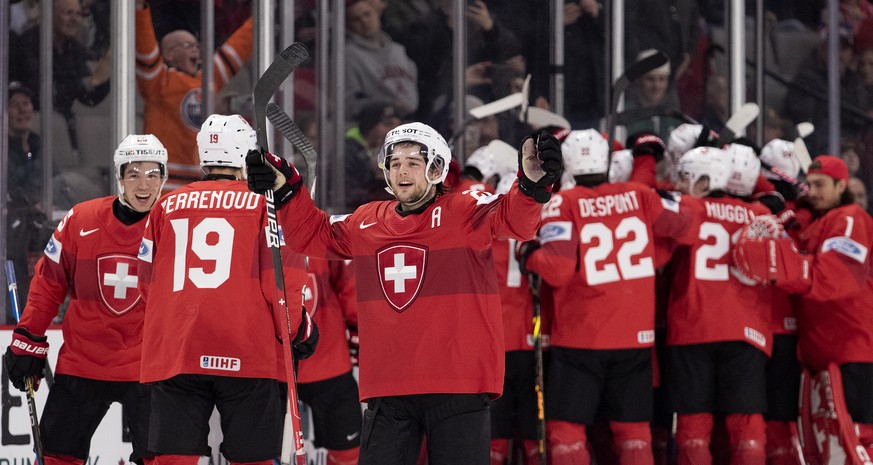 Switzerland celebrates after beating Slovakia in a shootout in a preliminary round game at the world junior hockey championships in Moncton, New Brunswick, on Saturday, Dec. 31, 2022. (Ron Ward/The Ca ...