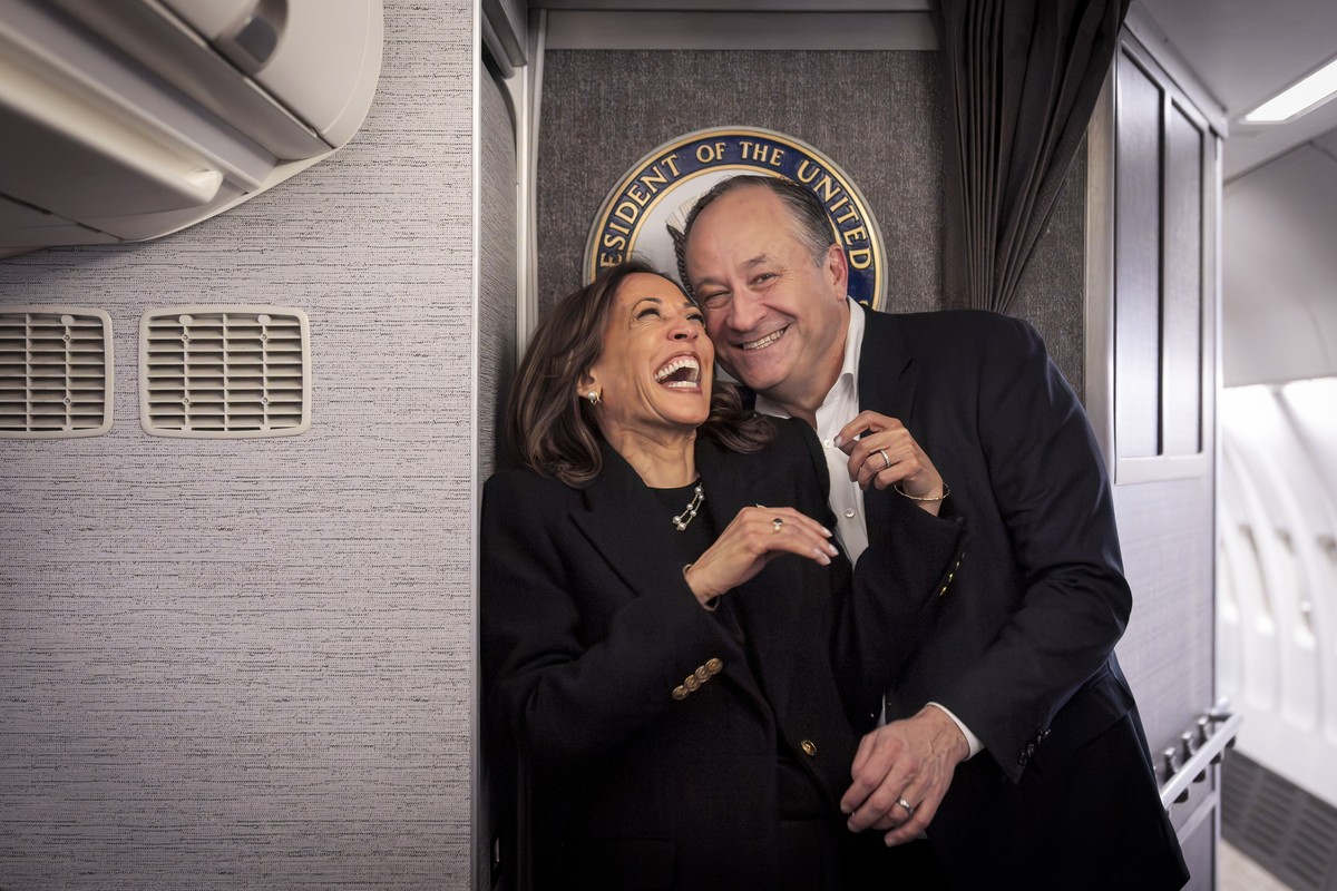 Democratic presidential nominee Vice President Kamala Harris, left, shares a laugh with second gentleman Doug Emhoff, after reuniting in Pittsburgh, Monday, Nov. 4, 2024, aboard Air Force Two, just be ...