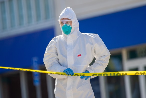 epa08327510 A healthcare professional from AFC Urgent Care waits for the next patient during a day of Covid-19 testing in the parking lot of their location in North Andover, Massachusetts, USA 27 Marc ...