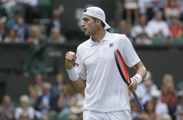 John Isner of the United States reacts after winning a point during his men&#039;s singles semifinals match against South Africa&#039;s Kevin Anderson at the Wimbledon Tennis Championships, in London, ...