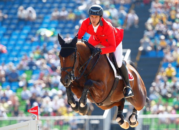 2016 Rio Olympics - Equestrian - Preliminary - Jumping Team Qualification - Olympic Equestrian Centre - Rio de Janeiro, Brazil - 14/08/2016. Steve Guerdat (SUI) of Switzerland riding Nino Des Buissonn ...