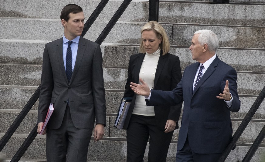 White House Senior Adviser Jared Kushner, left, Homeland Security Secretary Kirstjen Nielsen, and Vice President Mike Pence, talk as they walk down the steps of the Eisenhower Executive Office Buildin ...