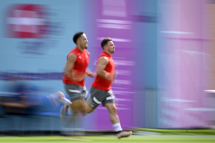 Switzerland&#039;s forward Noah Okafor, left, and Switzerland&#039;s midfielder Xherdan Shaqiri, right, attend a open training session of Swiss national soccer team in preparation for the FIFA World C ...