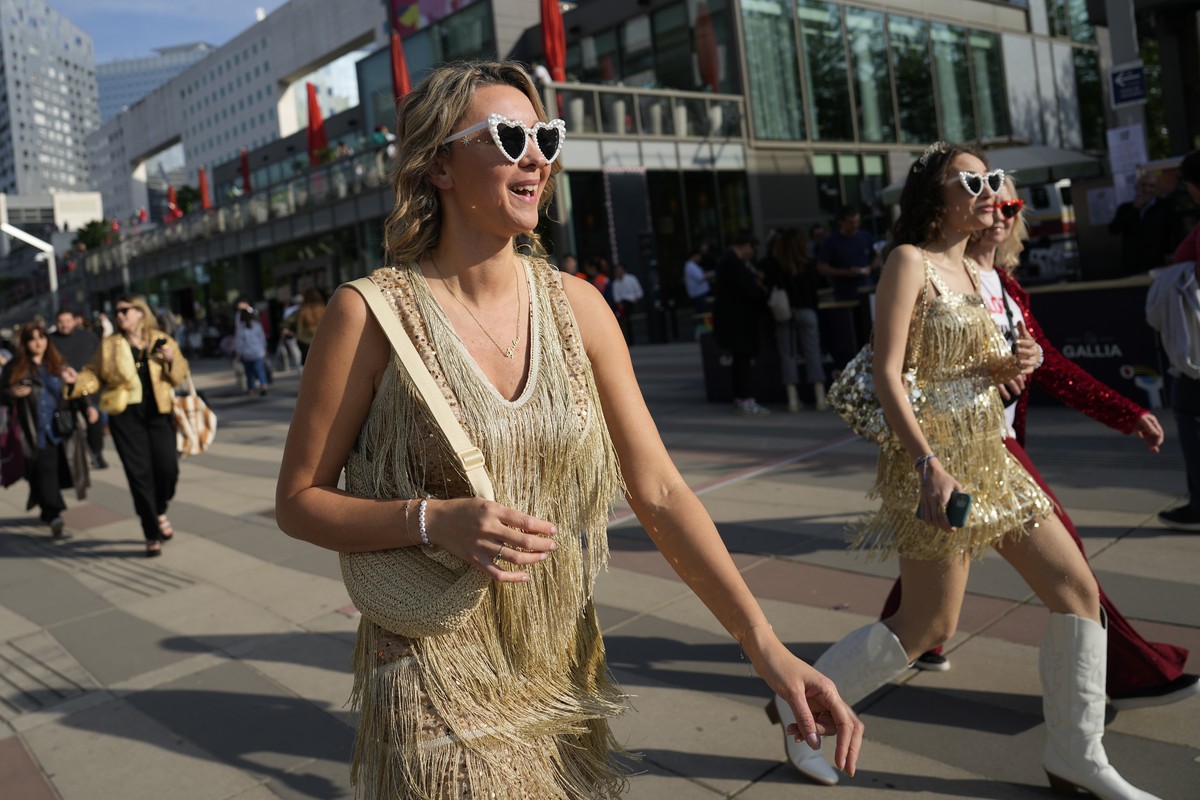 Fans arrive for the Taylor Swift concert at the Paris Le Defense Arena as a part of her Eras Tour concert in Paris, Thursday, May 9, 2024. (AP Photo/Lewis Joly)