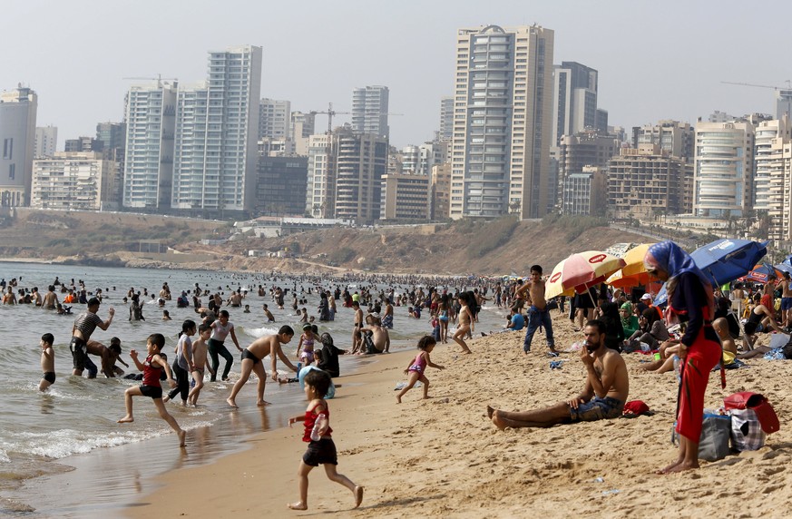 People gather at a public beach on Ramlet al Bayda seaside in Beirut, Lebanon August 2, 2015. REUTERS/Jamal Saidi