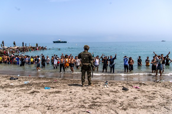 Spanish army soldiers block access to the beach for people crossing from Morocco into the Spanish enclave of Ceuta, Friday, July 31, 2026. (AP Photo/Antonio Sempere)
Spain Ceuta