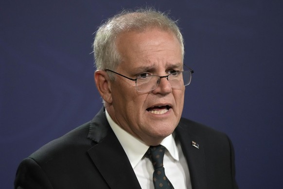 Australian Prime Minister Scott Morrison talks about the situation in Ukraine at a press conference in Sydney, Feb. 23, 2022. Former prime minister Morrison quietly gave himself extra powers during th ...