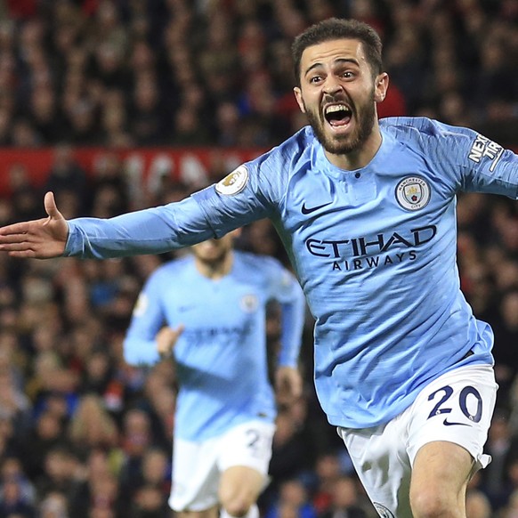 Manchester City's Bernardo Silva celebrates after scoring the opening goal during the English Premier League soccer match between Manchester United and Manchester City at Old Trafford Stadium in ...