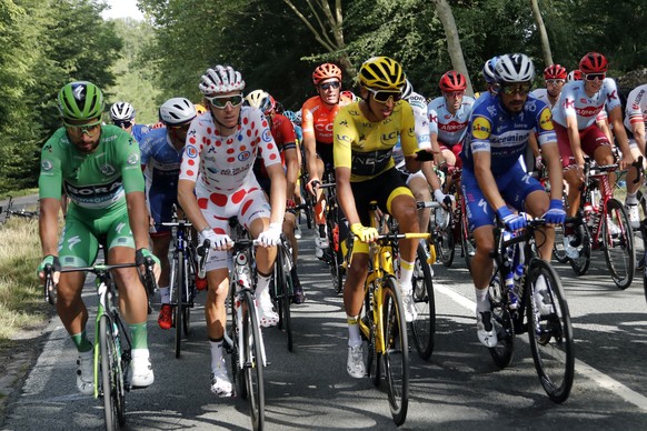 Colombia&#039;s Egan Bernal wearing the overall leader&#039;s yellow jersey, France&#039;s Romain Bardet wearing the best climber&#039;s dotted jersey, Slovakia&#039;s Peter Sagan wearing the best spr ...