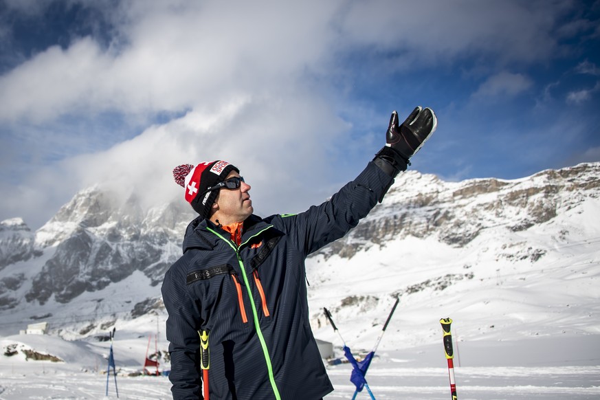 epa09605288 Didier Defago, former ski racer from Switzerland and designer of the slope, talks to journalists in the finish area of the new ski slope &#039;Gran Becca&#039; which will be part of the Al ...