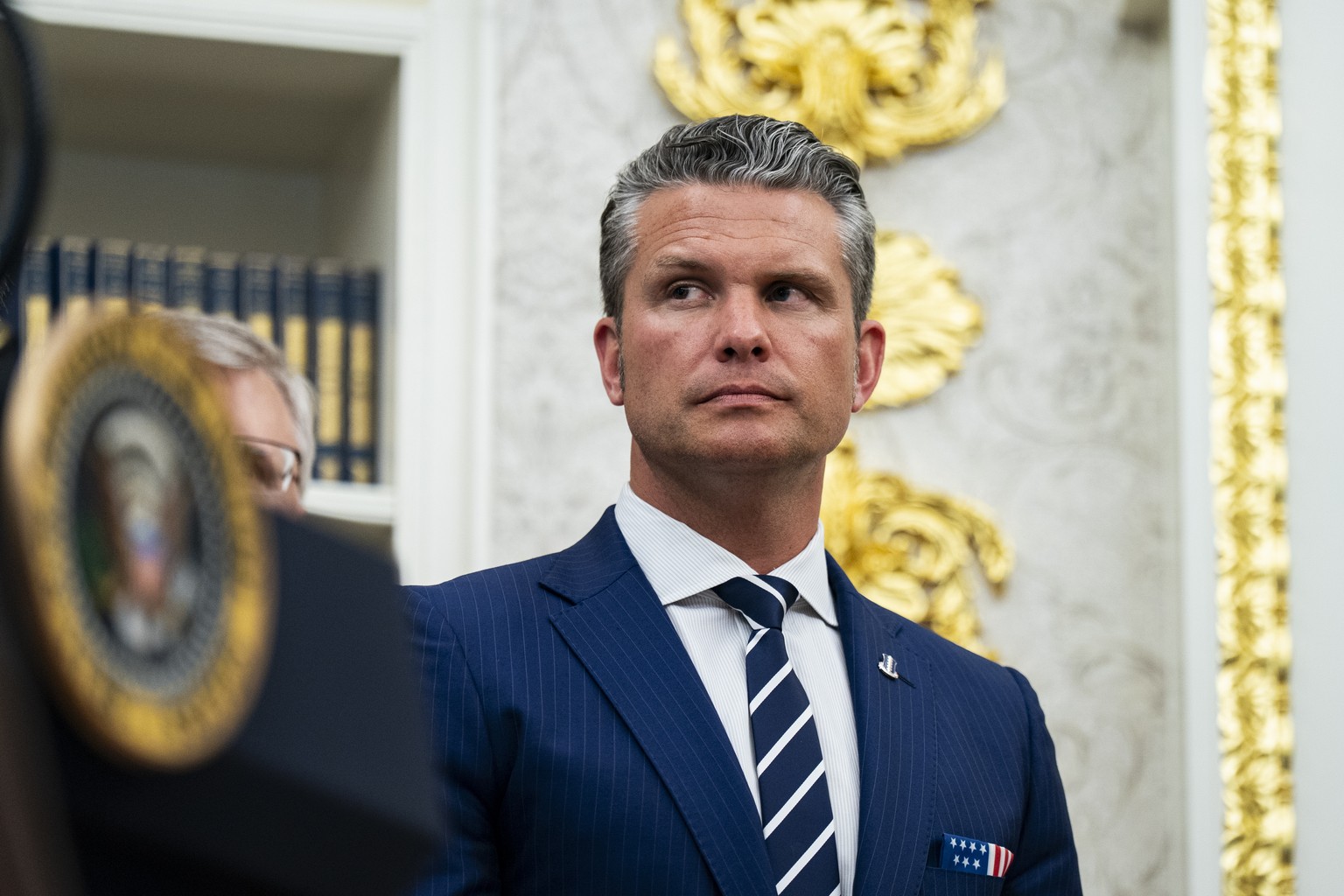 epa12347160 Pete Hegseth, US secretary of defence stands during an announcement in the Oval Office at the White House in Washington, DC, USA, 02 September 2025. US President Donald Trump is set to ann ...