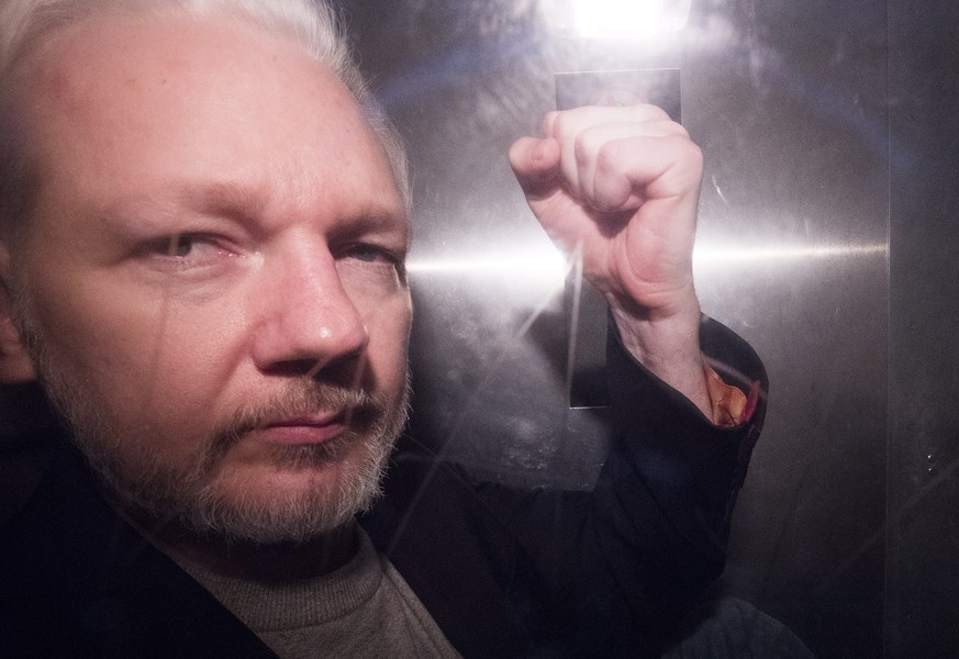 epa08918436 (FILE) - Wikileaks co-founder Julian Assange, in a prison van, as he leaves Southwark Crown Court in London, Britain, 01 May 2019 (reissued 04 January 2021). British media report London&#0 ...
