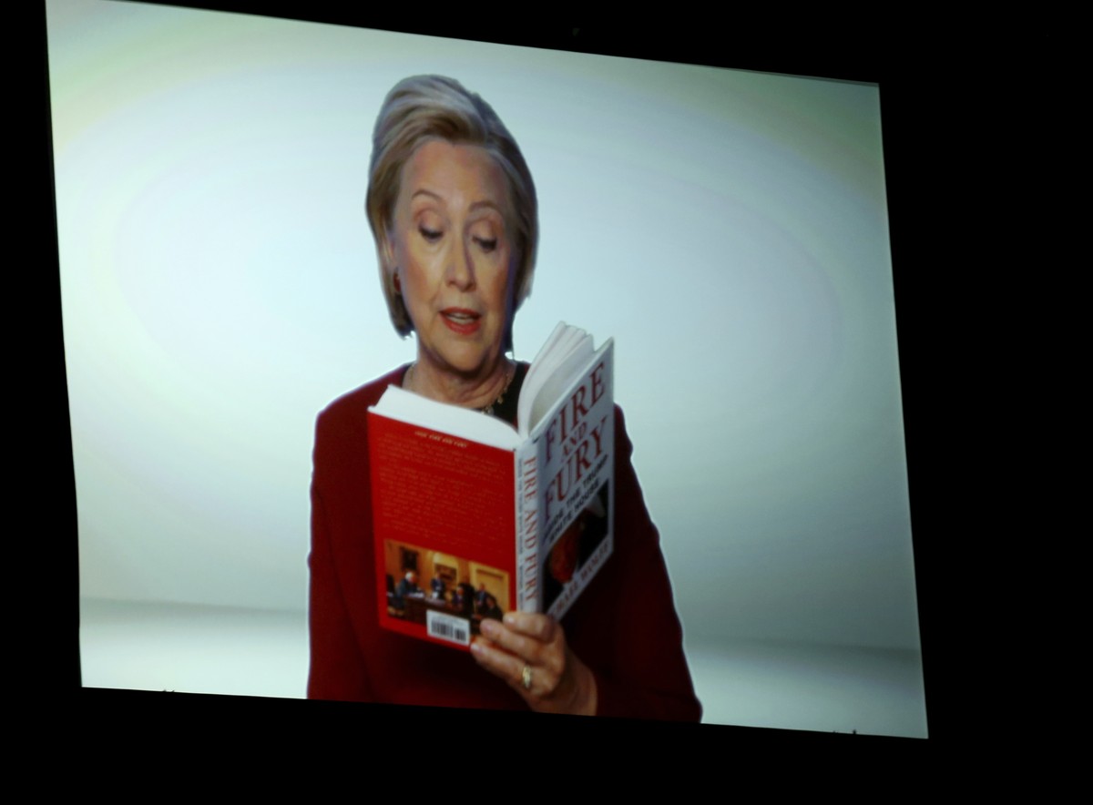 Hillary Clinton appears on screen reading an excerpt from the book "Fire and Fury" during a skit at the 60th annual Grammy Awards at Madison Square Garden on Sunday, Jan. 28, 2018, in New Yo ...