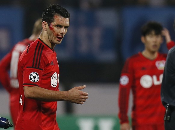 Leverkusen&#039;s Emir Spahic leaves the pitch bleeding during the UEFA Champions League group C soccer match between Zenit St. Petersburg and Bayer 04 Leverkusen in St.Petersburg, Russia, Tuesday, No ...