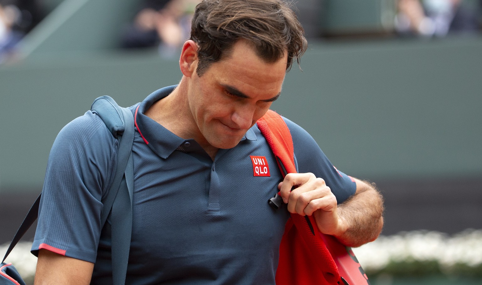 epa09209154 Roger Federer of Switzerland reacts after losing his second round match against Pablo Andujar of Spain at the ATP 250 Geneva Open tennis tournament in Geneva, Switzerland, 18 May 2021. EPA ...