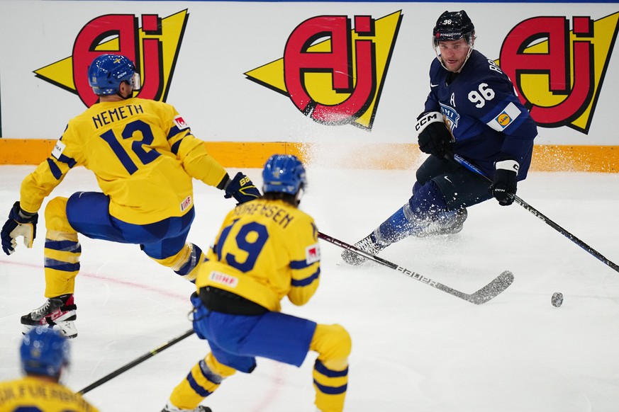 Finland&#039;s Mikko Rantanen, right, controls the puck during the group A match between Finland and Sweden at the ice hockey world championship in Tampere, Finland, Monday, May 15, 2023. (AP Photo/Pa ...