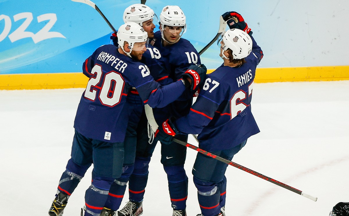 epa09744177 Brendan Brisson (2-L) of the USA celebrates with teammates after scoring a goal during the Men's Ice Hockey preliminary round match between the USA and China at the Beijing 2022 Olymp ...