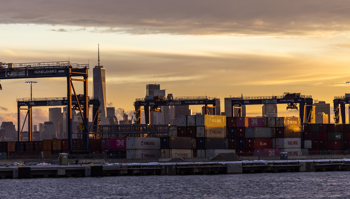 Cranes and shipping containers are seen at Port Jersey with the New York City skyline in the background during a port strike, Tuesday, Oct. 1, 2024, in Bayonne. (AP Photo/Eduardo Munoz Alvarez)