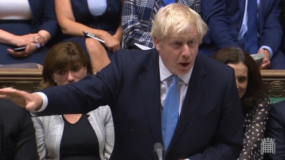 epa07831306 A grab from a handout video made available by the UK Parliamentary Recording Unit shows Prime Minister Boris Johnson speaking during the debate of a motion calling by the government for mo ...