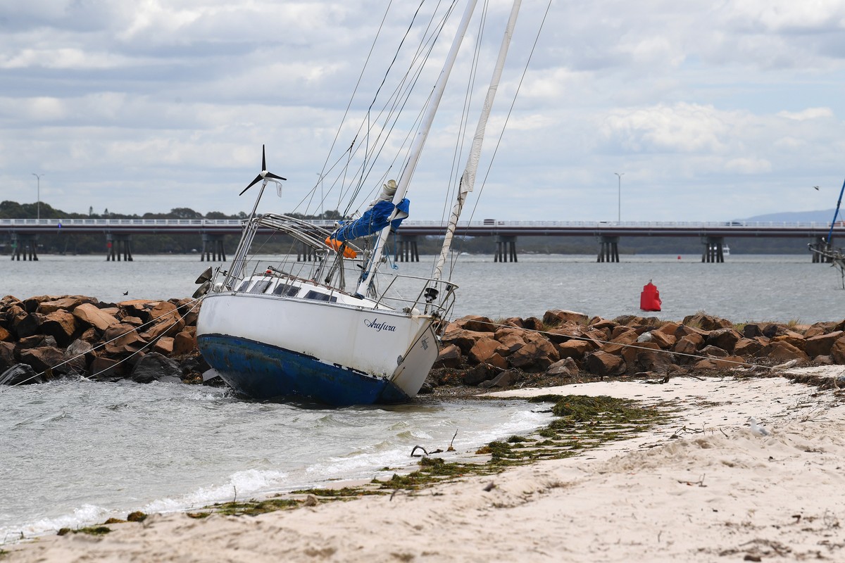 epa11938976 A boat is seen beached after it was blown from its mooring on Bribie Island, Brisbane, Australia, 04 March 2025. Residents are advised to prepare for the incoming tropical Cyclone Alfred w ...