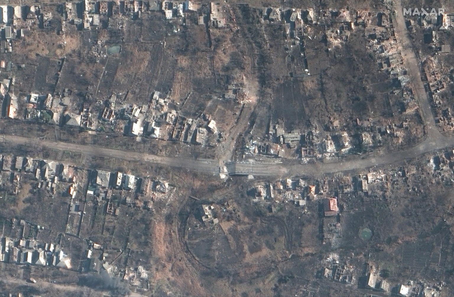 epa10513685 A handout satellite image made available by Maxar Technologies on 10 March 2023 shows a destroyed bridge and roadway, amid the ongoing battle for Bakhmut, Ukraine, 06 March 2023 (issued 10 ...