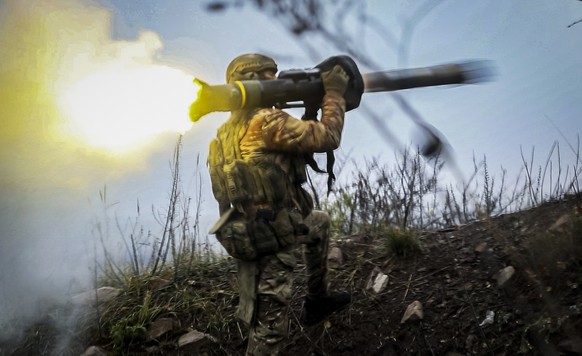 A Ukrainian soldier fires an anti-tank missile at an undisclosed location in the Donetsk region, Ukraine, Thursday, Nov. 17, 2022. (AP Photo/Roman Chop)