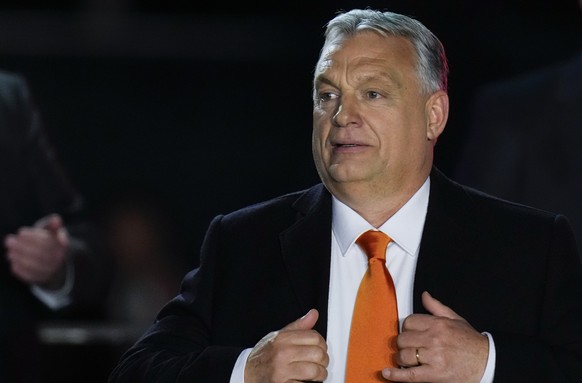 FILE - Hungary&#039;s Prime Minister Viktor Orban acknowledges cheering supporters during an election night rally in Budapest, Hungary, on April 3, 2022. The European Union wants to impose a new round ...
