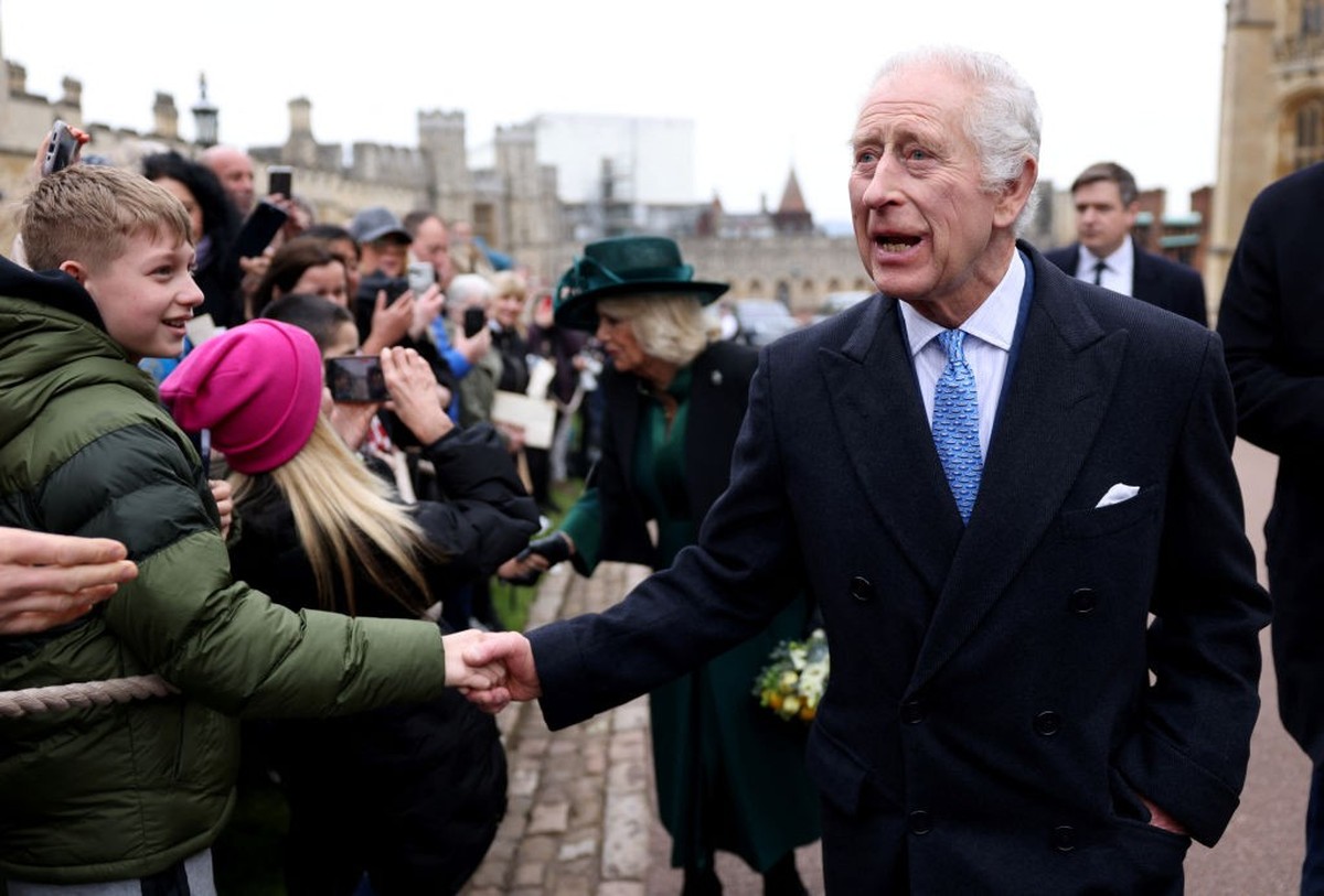 WINDSOR, ENGLAND - MARCH 31: King Charles III and Queen Camilla greet people after attending the Easter Matins Service at St. George's Chapel, Windsor Castle, on March 31, 2024 in Windsor, Englan ...