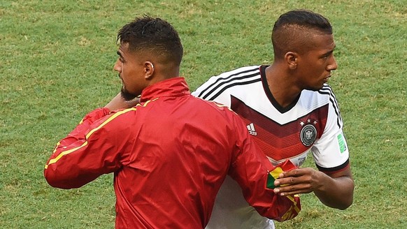 epa04271495 Kevin Prince Boateng (L) of Ghana greets his brother Jerome Boateng (R) of Germany before the FIFA World Cup 2014 group G preliminary round match between Germany and Ghana at the Estadio C ...