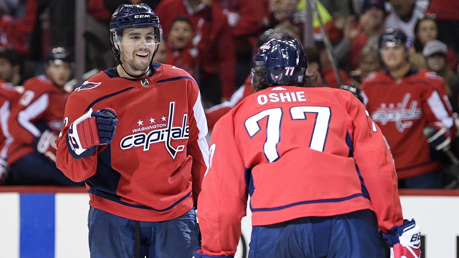 Washington Capitals defenseman Matt Niskanen, left, celebrates his goal with right wing T.J. Oshie (77) during the second period of an NHL hockey game against the Columbus Blue Jackets, Friday, Nov. 9 ...
