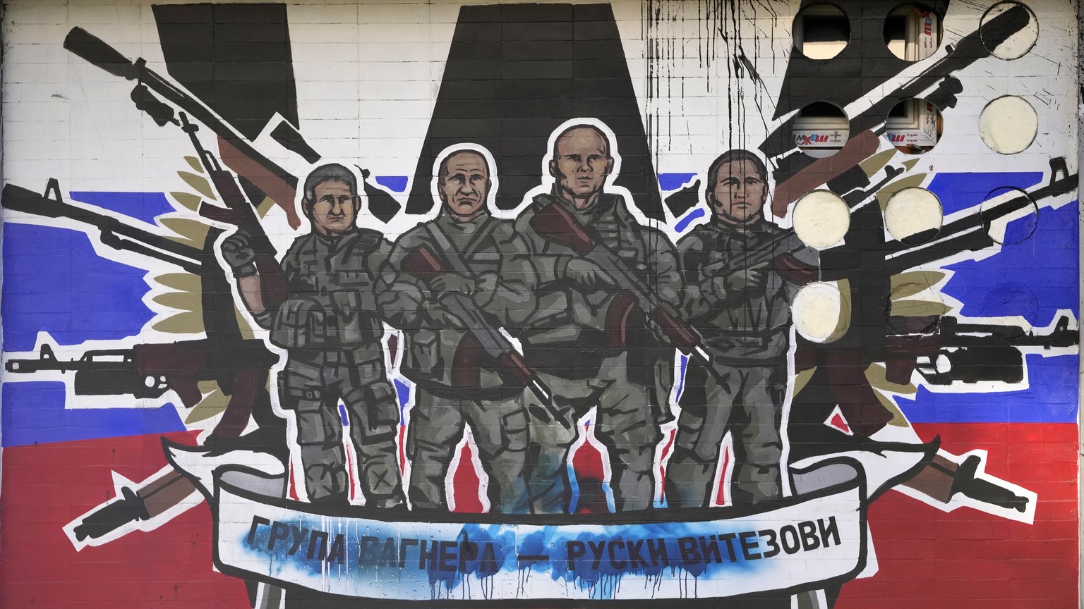 FILE - A mural depicting mercenaries of Russia&#039;s Wagner Group that reads: &quot;Wagner Group - Russian knights&quot; vandalized with paint on a wall in Belgrade, Serbia, on Jan. 13, 2023. Russia& ...