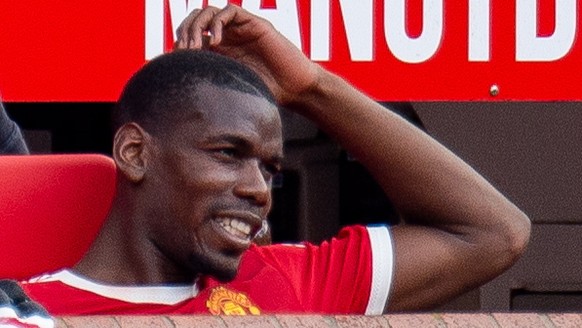 epa09893443 Manchester United&#039;s Paul Pogba reacts on the bench during the English Premier League soccer match between Manchester United vs Norwich at Old Trafford, Manchester, Britain, 16 April 2 ...