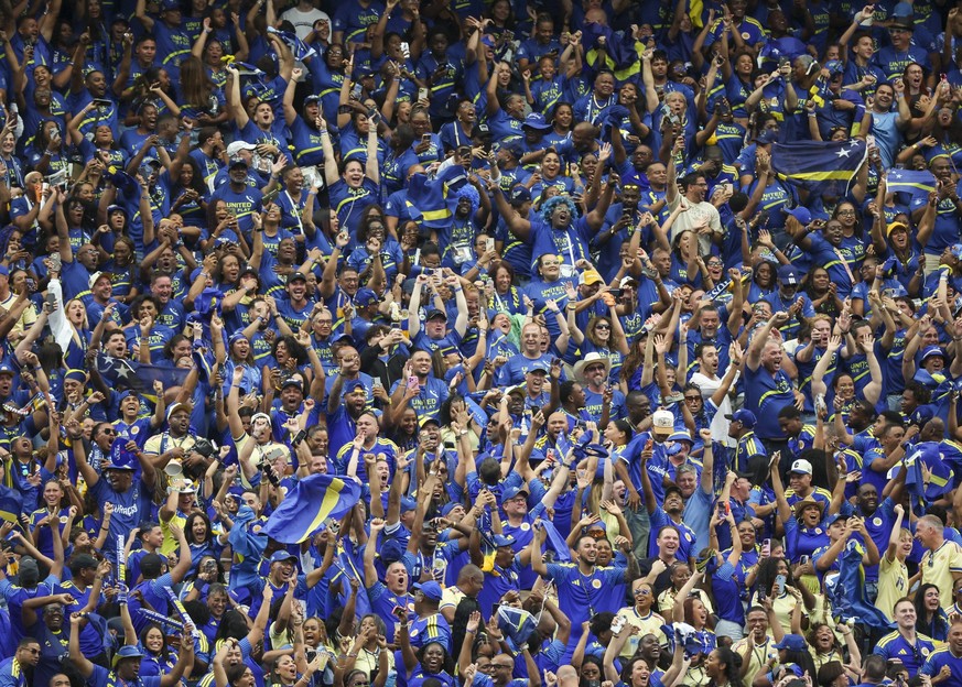 HOUSTON, TX - JUNE 14: Curacao fans cheer following the goal by Livano Comenencia 8 of Curacao not pictured in the first half during the FIFA World Cup, WM, Weltmeisterschaft, Fussball 2026 Group E ma ...
