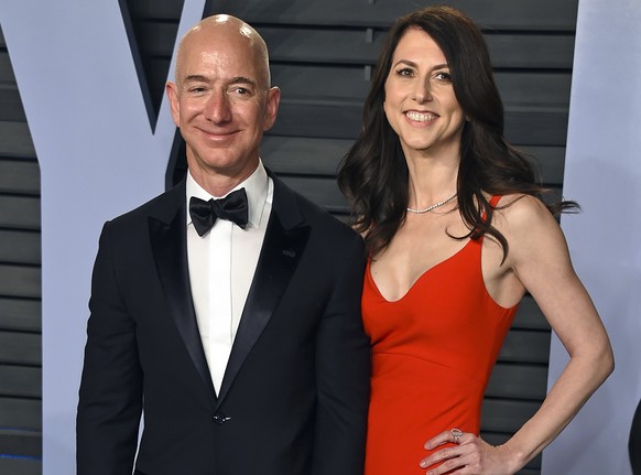 FILE - In this March 4, 2018 file photo, Jeff Bezos and wife MacKenzie Bezos arrive at the Vanity Fair Oscar Party in Beverly Hills, Calif. The founder of Amazon and his wife have made their largest p ...