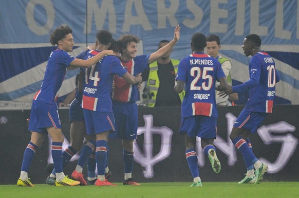 PSG players celebrate after Ferran Torres scored the opening goal during the French League One soccer match between Marseille and Paris Saint-Germain in Marseille, France, Sunday, Sept. 20, 2026. (AP  ...