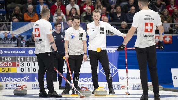 Switzerland's skip Sven Michel, Benoit Schwarz-Van Berkel, Yannick Schwaller and Pablo Lachat-Couchepin, left to right, react after their play against Scotland at the World Men's Curling Cha ...