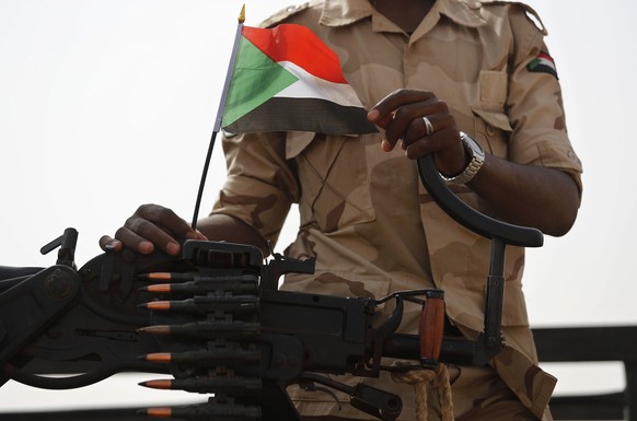 FILE - In this June 22, 2019 file photo, a Sudanese soldier from the Rapid Support Forces or RSF, led by Gen. Mohammed Hamdan Dagalo, stands on his vehicle during a military-backed tribe&#039;s rally, ...