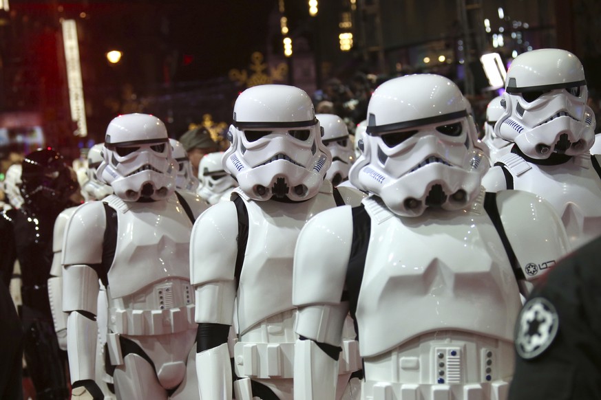 FILE - In this Dec. 16, 2015. file photo, people dressed as stormtroopers walk on the red carpet upon arrival at the European premiere of the film &#039;Star Wars: The Force Awakens&#039; in London. M ...