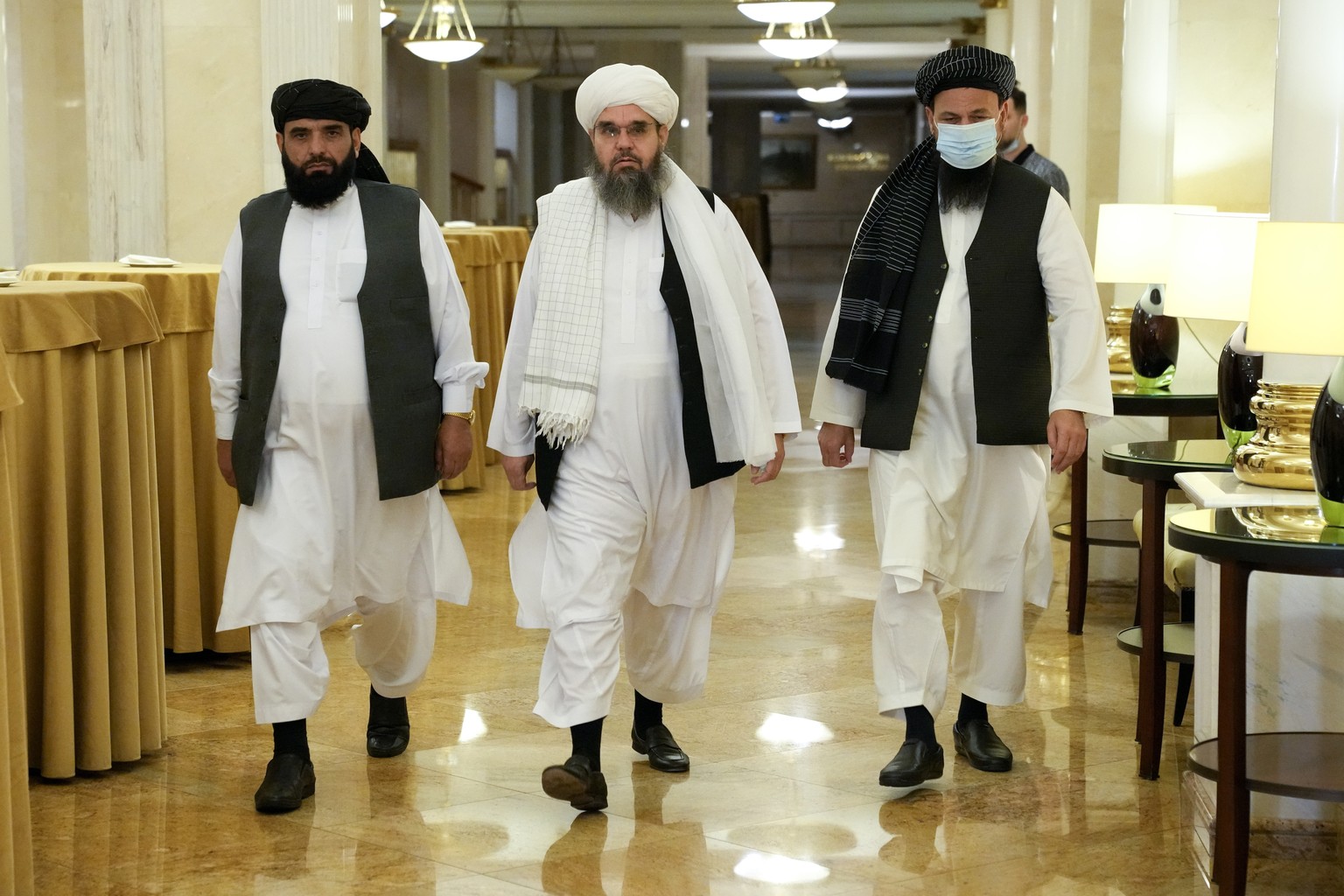 FILE In this file photo taken on Friday, July 9, 2021, Members of political delegation from the Afghan Taliban's movement Suhil Shaheen, left, Mawlawi Shahabuddin Dilawar, center, and Dr, Mohammad Nai ...