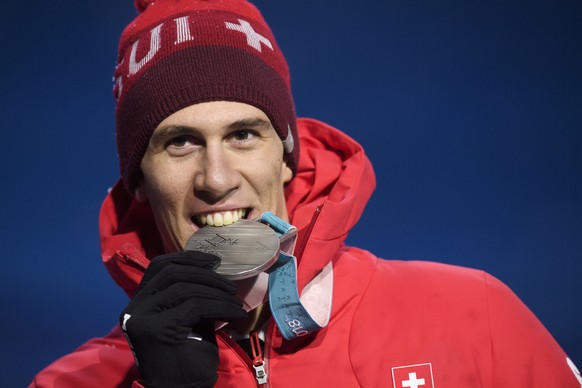 Silver medalist Ramon Zenhaeusern of Switzerland celebrates during the victory ceremony on the Medal Plaza for the men alpine skiing slalom event at the XXIII Winter Olympics 2018 in Pyeongchang, South Korea, on Thursday, February 22, 2018. (KEYSTONE/Gian Ehrenzeller)