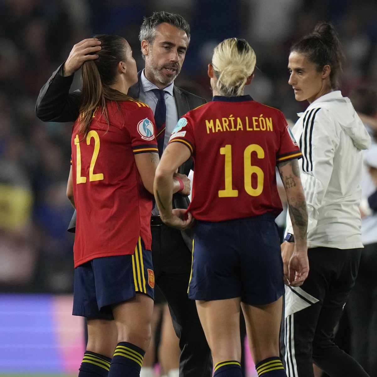 Spain's manager Jorge Vilda, centre, talks with Patri Guijarro, centre left, and Mapi Leon after the Women Euro 2022 quarter final soccer match between England and Spain at the Falmer stadium in  ...
