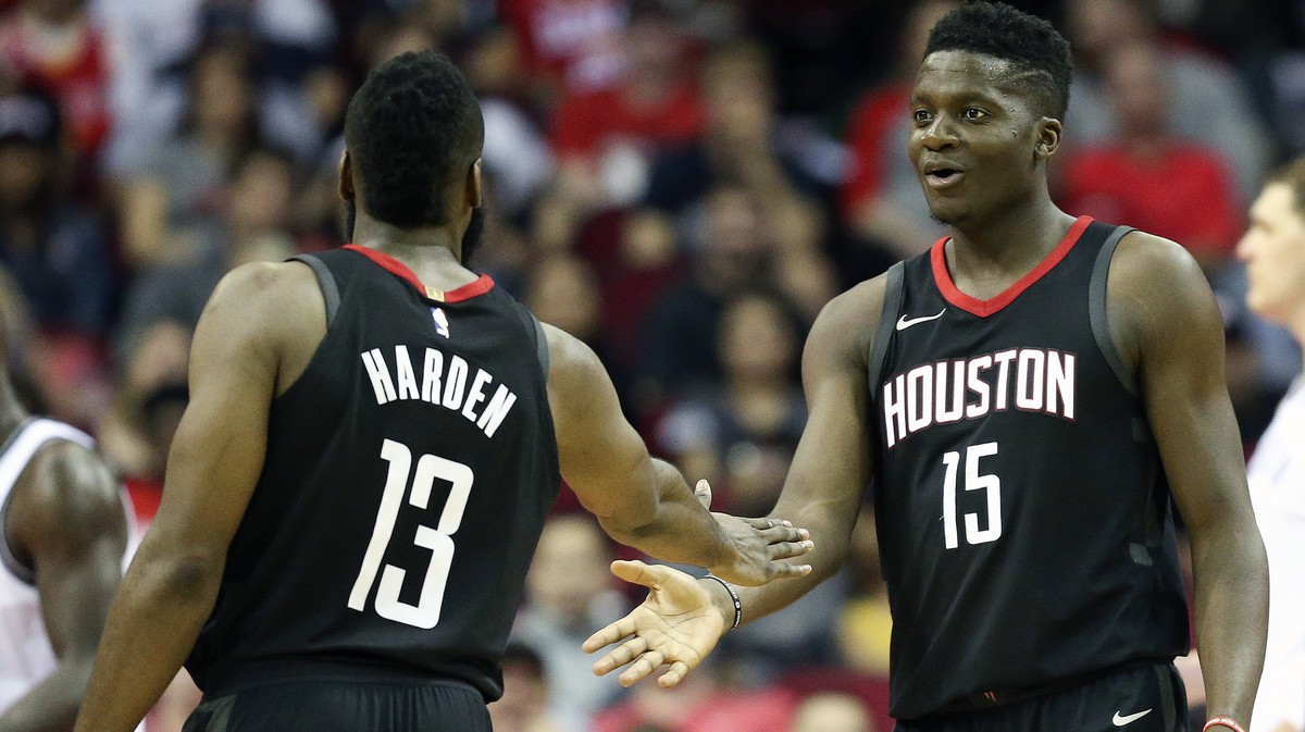 Houston Rockets center Clint Capela (15) shakes guard James Harden's hand after drawing a foul during the second half of an NBA basketball game against the Brooklyn Nets, Monday, Nov. 27, 2017, i ...